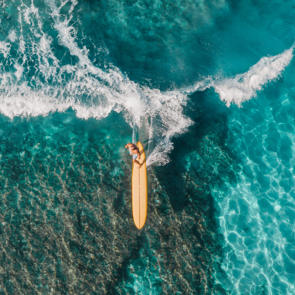 Person surfing on sea waves